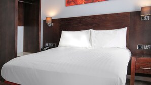A large bed with white linens, wooden headboard, and two bedside tables with lamps. - The Stuart Hotel Derby, Derby City Centre, Sure Collection by Best Western (Derby)