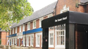 A hotel entrance with a sign for The Stuart Hotel, a Tesco Express store, and a no smoking sign. - The Stuart Hotel Derby, Derby City Centre, Sure Collection by Best Western (Derby)