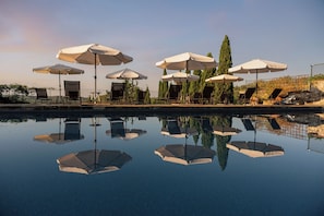 Seasonal outdoor pool, a rooftop pool, pool umbrellas, sun loungers