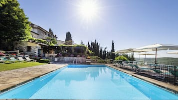 Seasonal outdoor pool, a rooftop pool, pool umbrellas, pool loungers