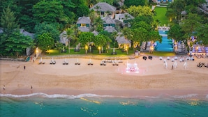 An aerial view of a resort with multiple buildings, a beach, and a swimming pool. - Layana Resort and Spa - Adult Only (Ko Lanta)