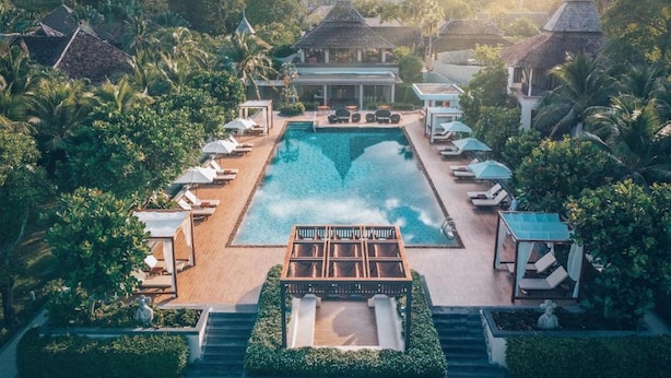 A resort with a central swimming pool, lounge areas, and traditional architecture. - Layana Resort and Spa - Adult Only (Ko Lanta)