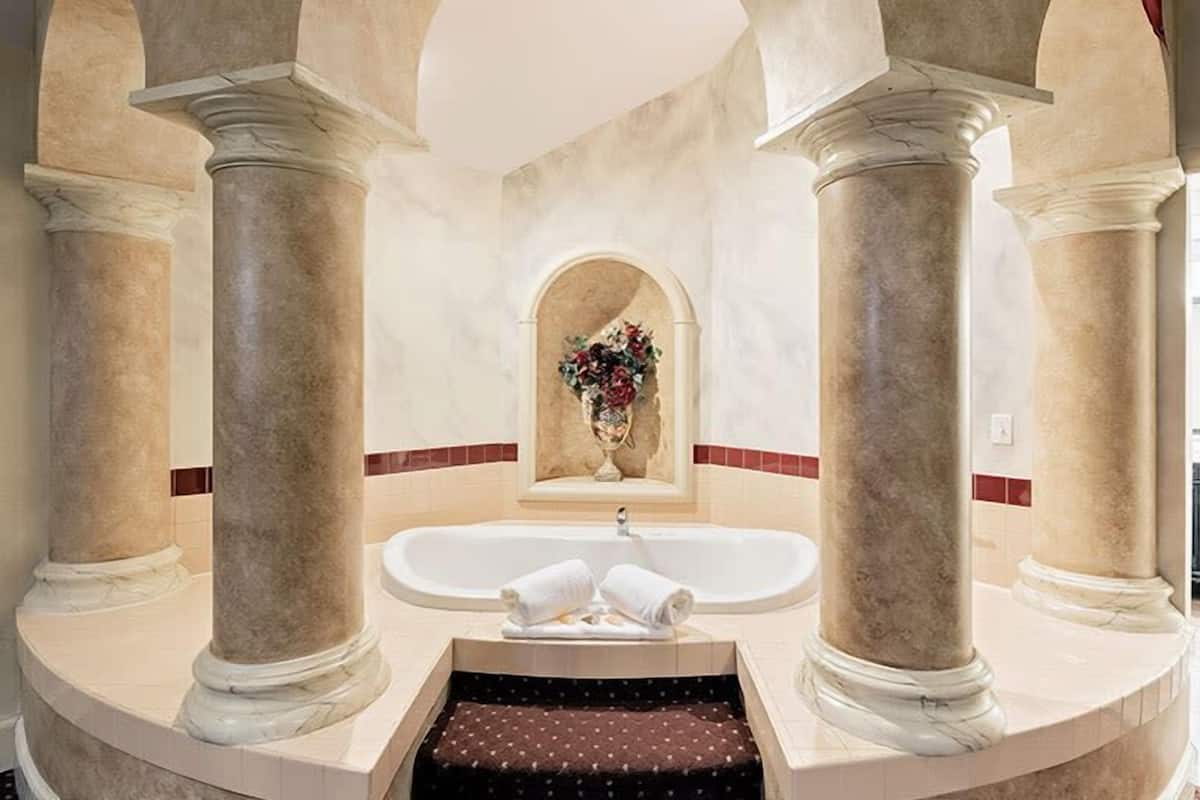 tuscany suite | bathroom | combined shower/bathtub, jetted bath, designer toiletries, hair dryer