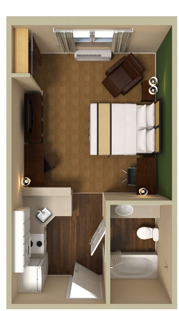 A compact hotel room with a bed, a small kitchenette, a bathroom, and a seating area with a table and chairs.