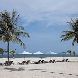 Private beach, white sand, sun loungers, beach umbrellas