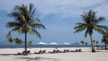 Private beach, white sand, sun loungers, beach umbrellas