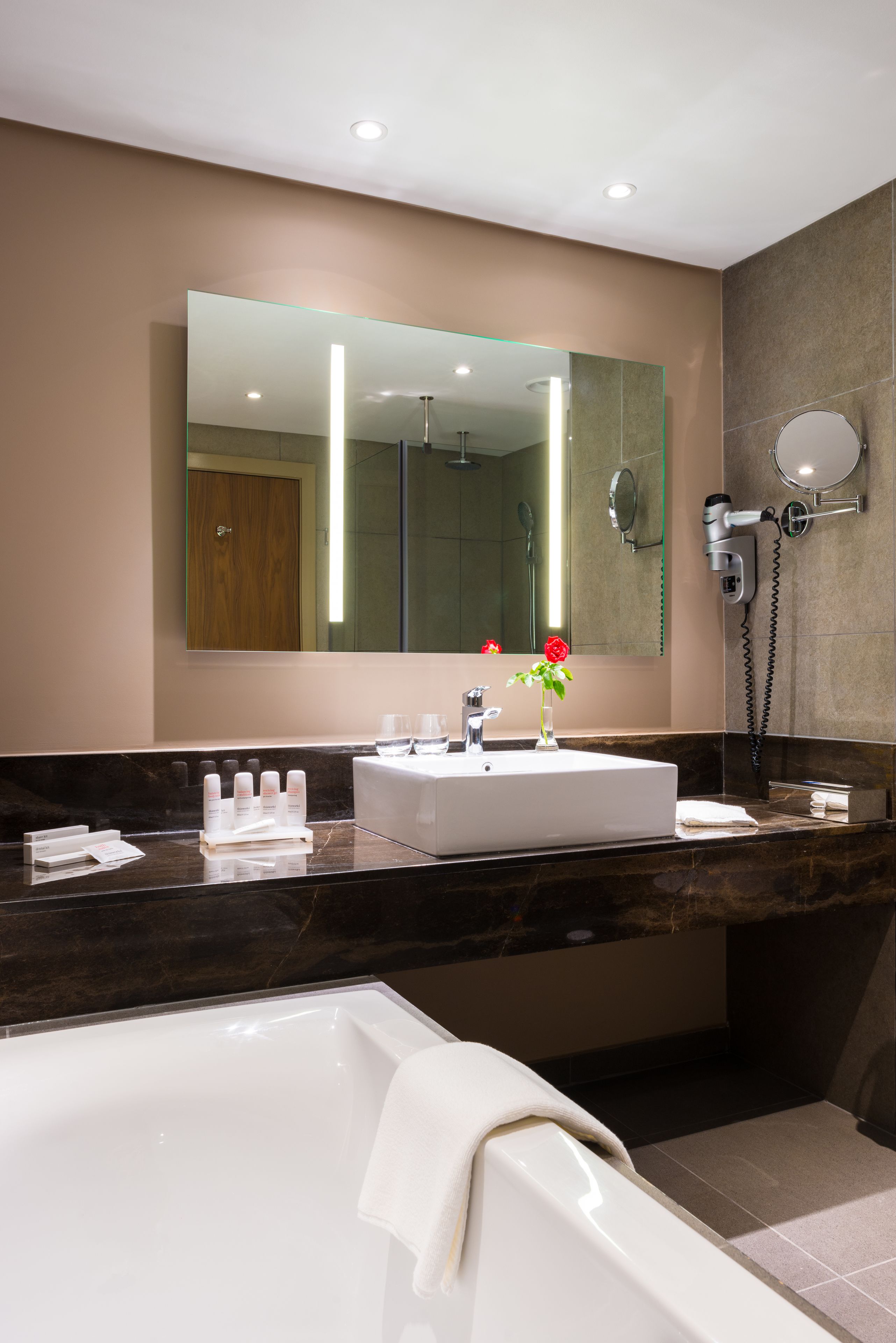 junior suite | bathroom | hydromassage showerhead, free toiletries, towels, soap