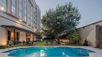 Seasonal outdoor pool, pool loungers