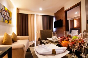 Standard Suite, 1 Bedroom, Non Smoking | Living area | 32-inch LED TV with cable channels, TV