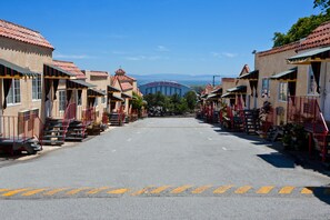 A street leading to a building with a sign reading "Cow Palace".