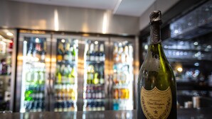 A bottle of Dom Perignon Champagne Vintage 2008 on a bar counter with a blurred background of a bar. - The Crown Hotel Bawtry, Doncaster (Doncaster)