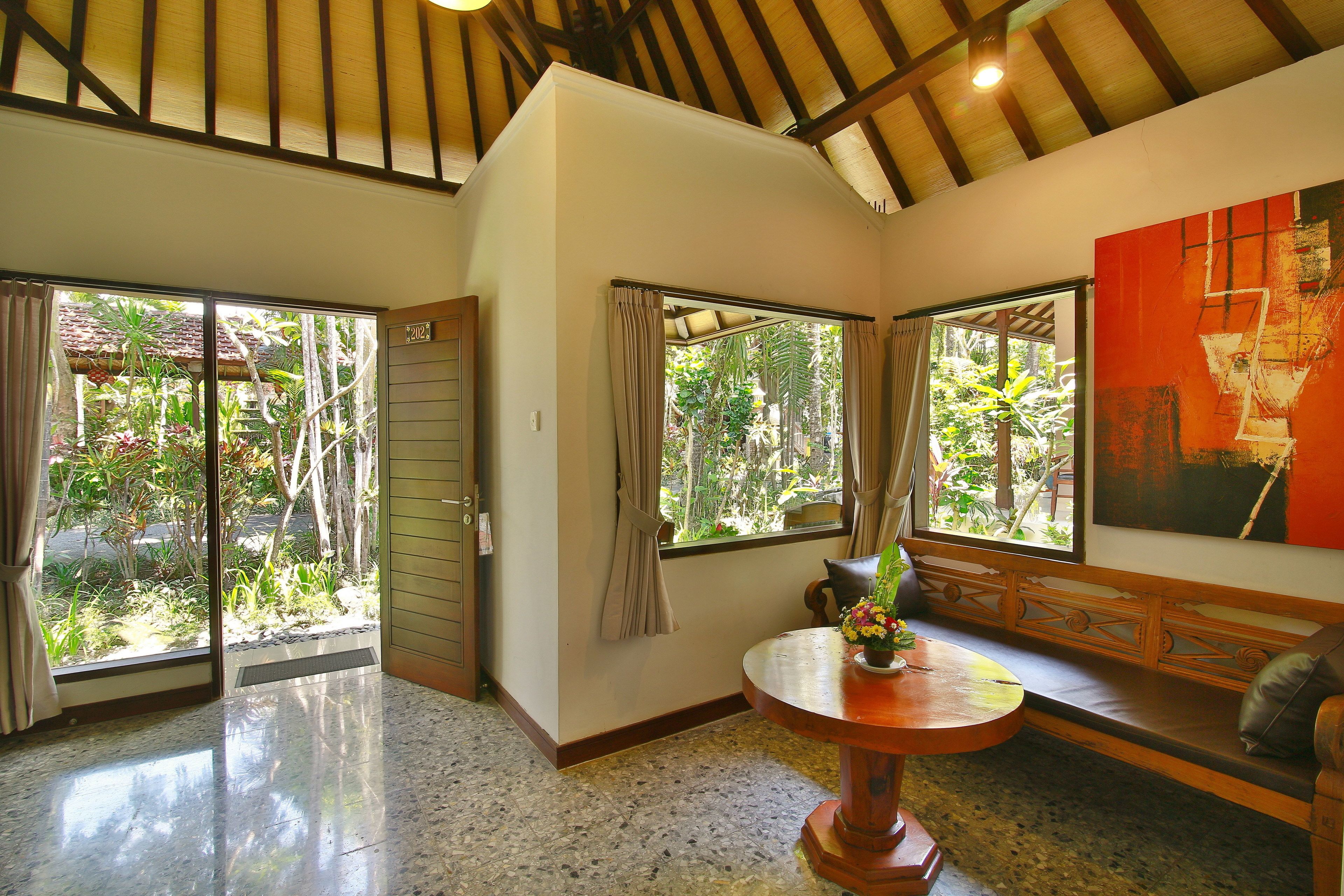 deluxe room with garden view | living area | 32-inch lcd tv with cable channels, tv