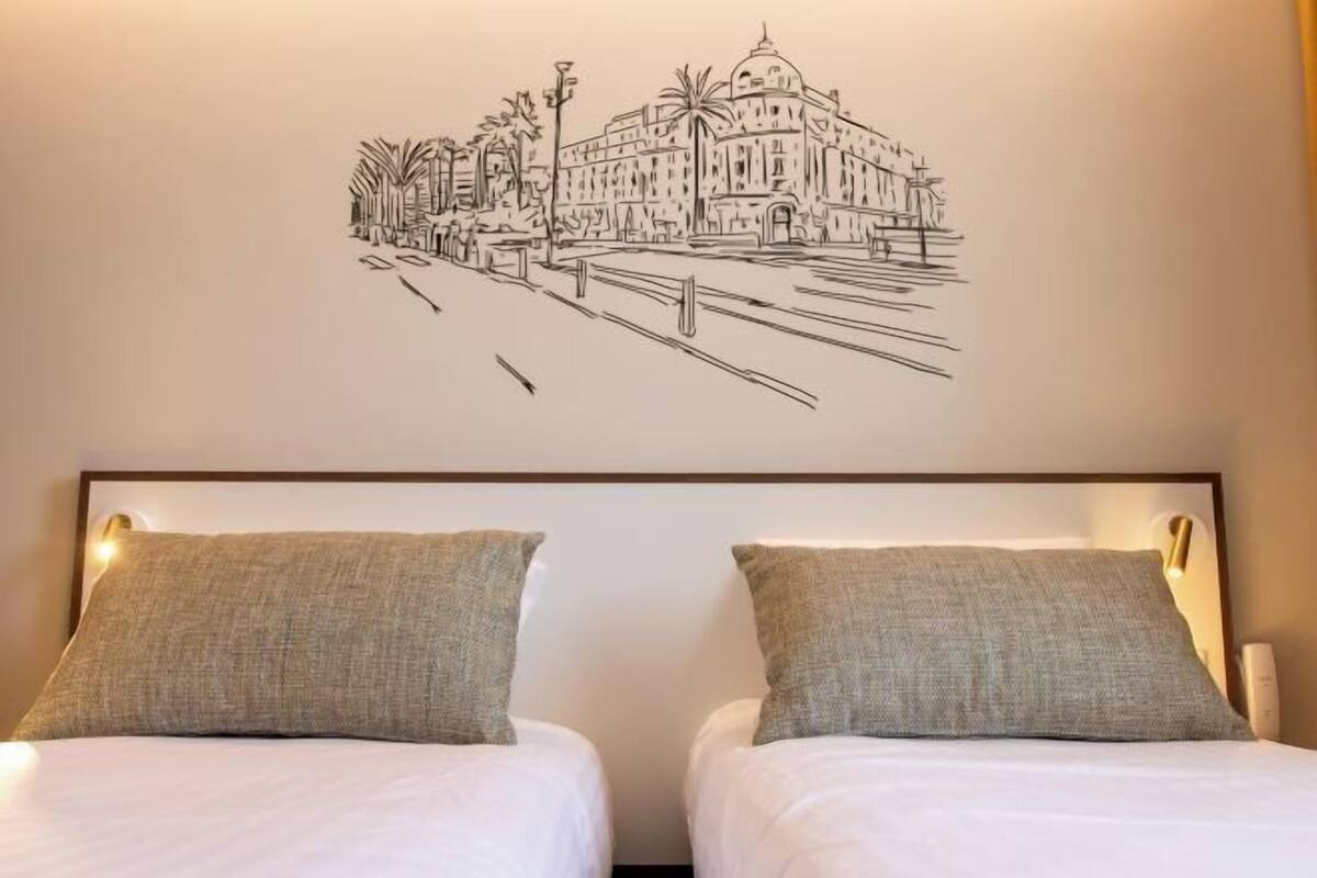 Premium bedding, desk, laptop workspace, blackout drapes