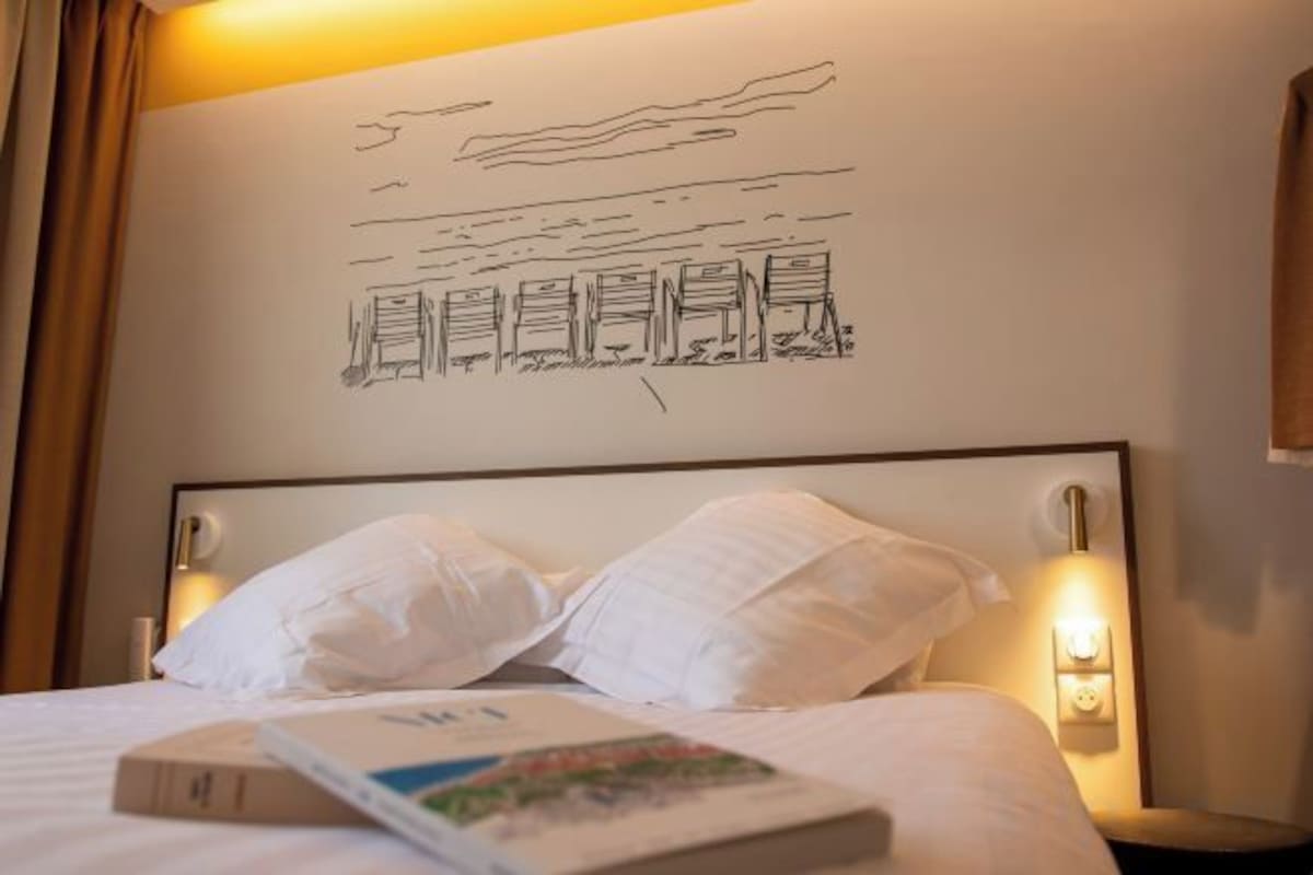 Premium bedding, desk, laptop workspace, blackout curtains