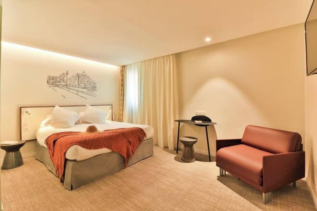 Premium bedding, desk, laptop workspace, blackout drapes