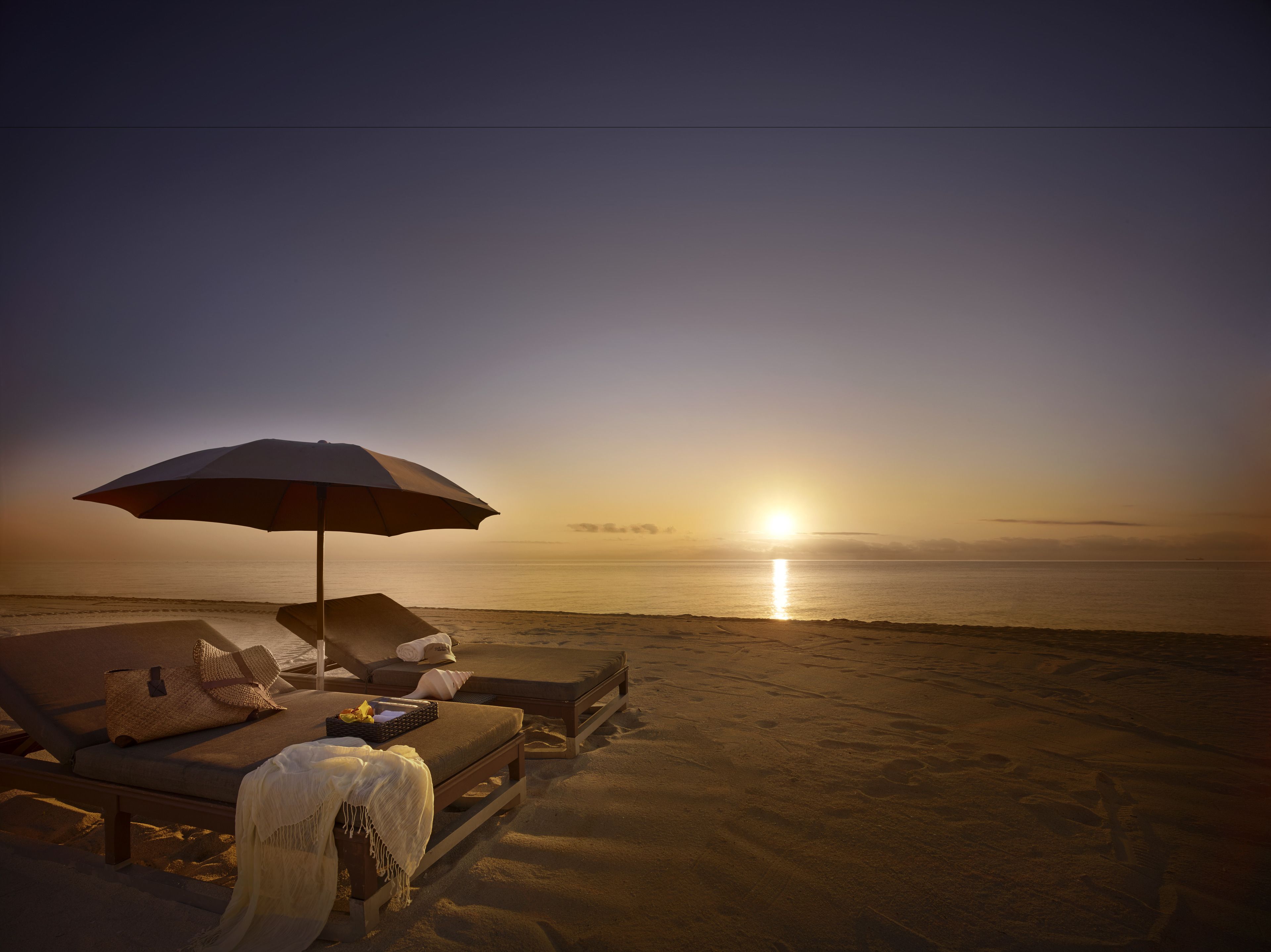 On the beach, sun loungers, beach umbrellas, beach towels