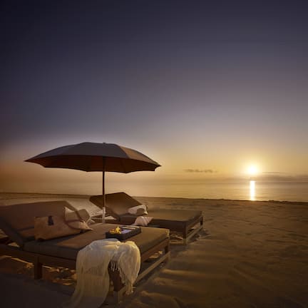 On the beach, sun loungers, beach umbrellas, beach towels