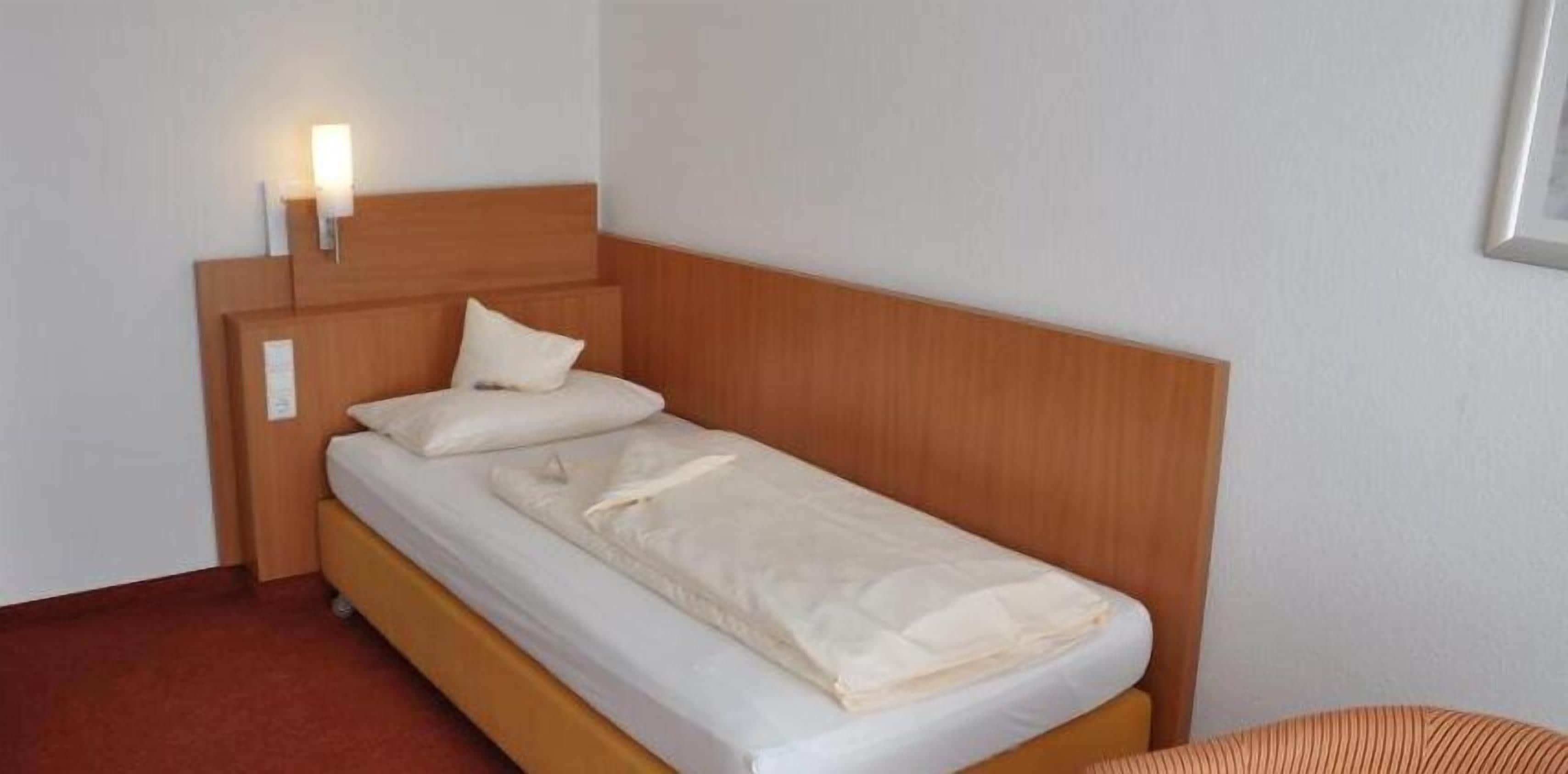 hypo-allergenic bedding, desk, blackout curtains, iron/ironing board