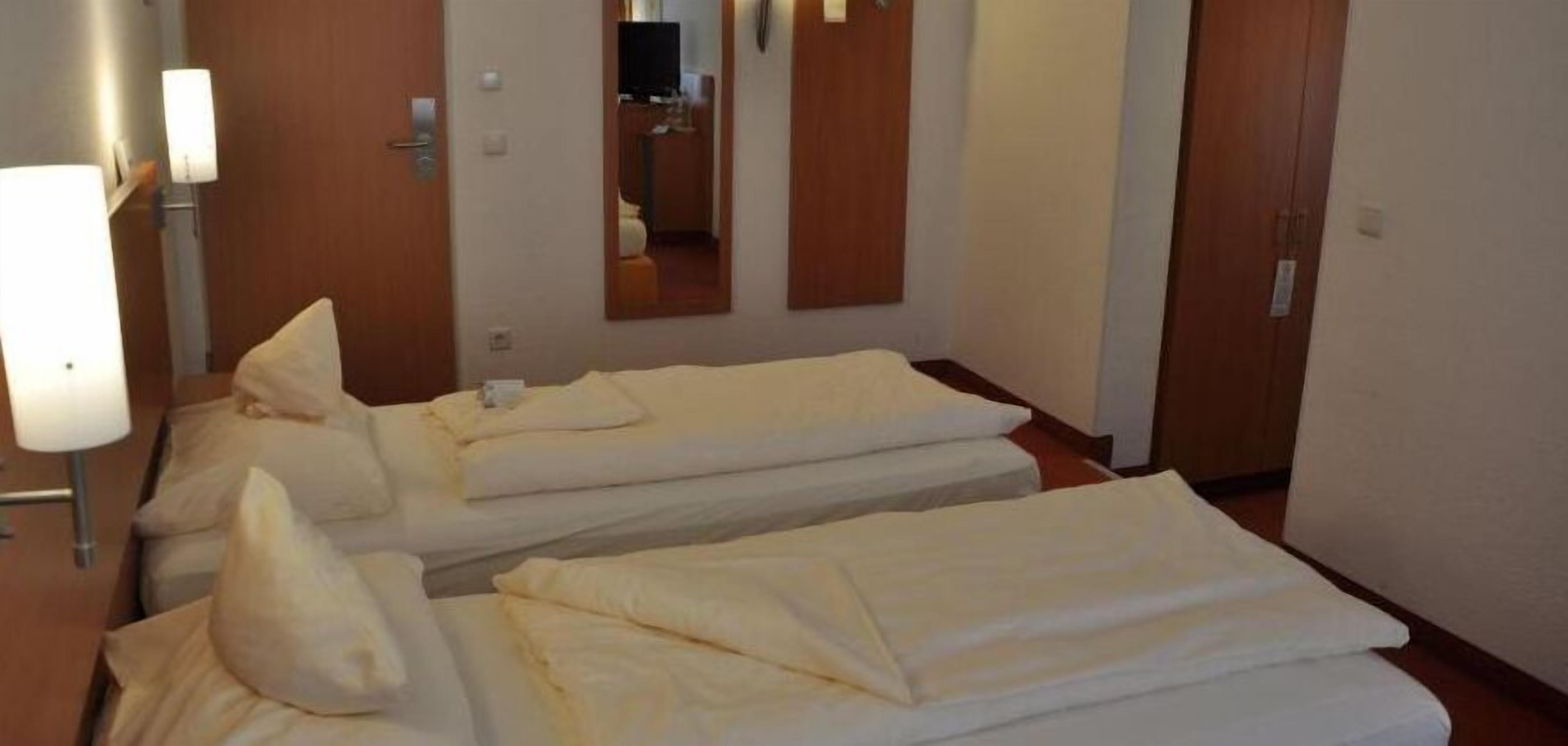 hypo-allergenic bedding, desk, blackout curtains, iron/ironing board