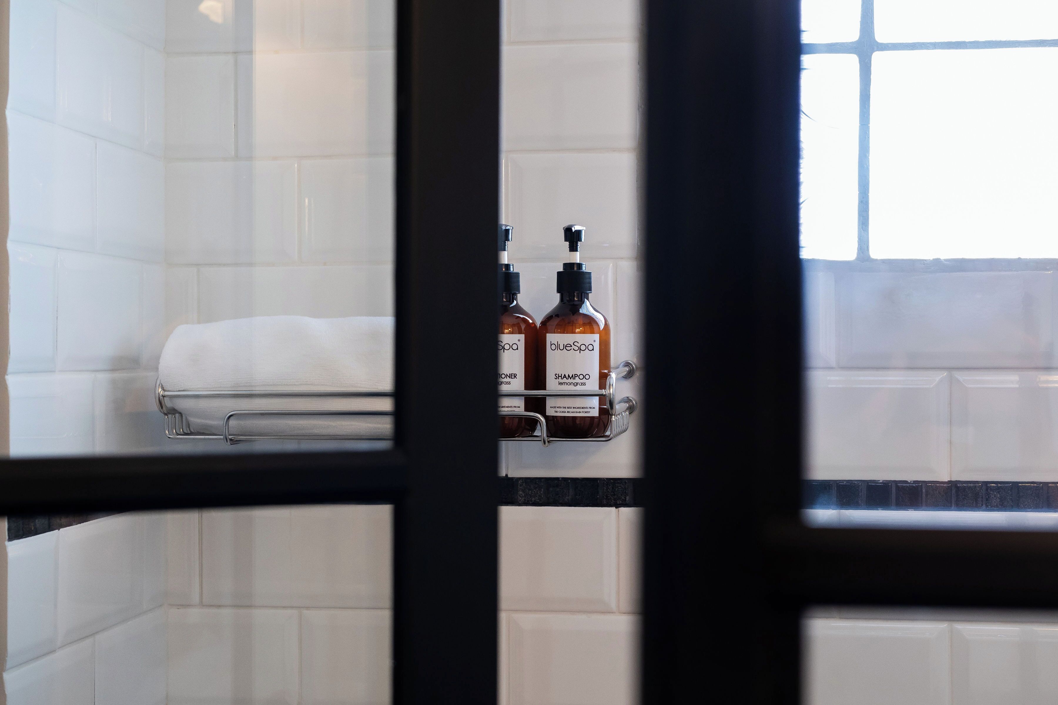 the apex | bathroom | shower, designer toiletries, hair dryer, towels