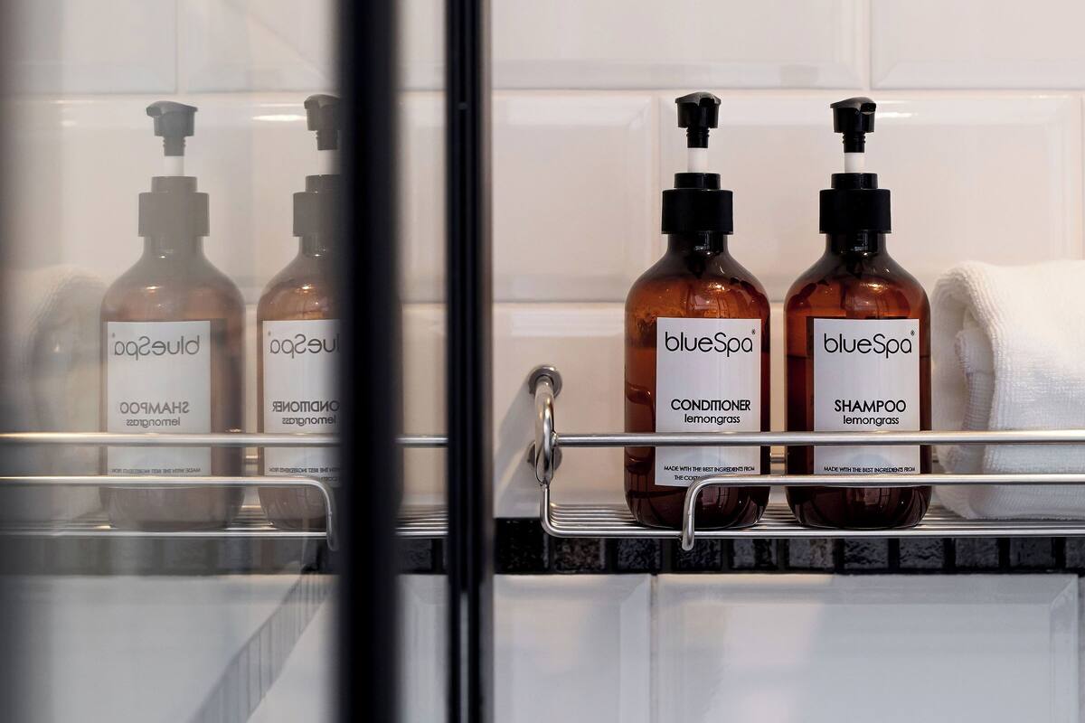 premium room, 1 king bed | bathroom | shower, designer toiletries, hair dryer, towels