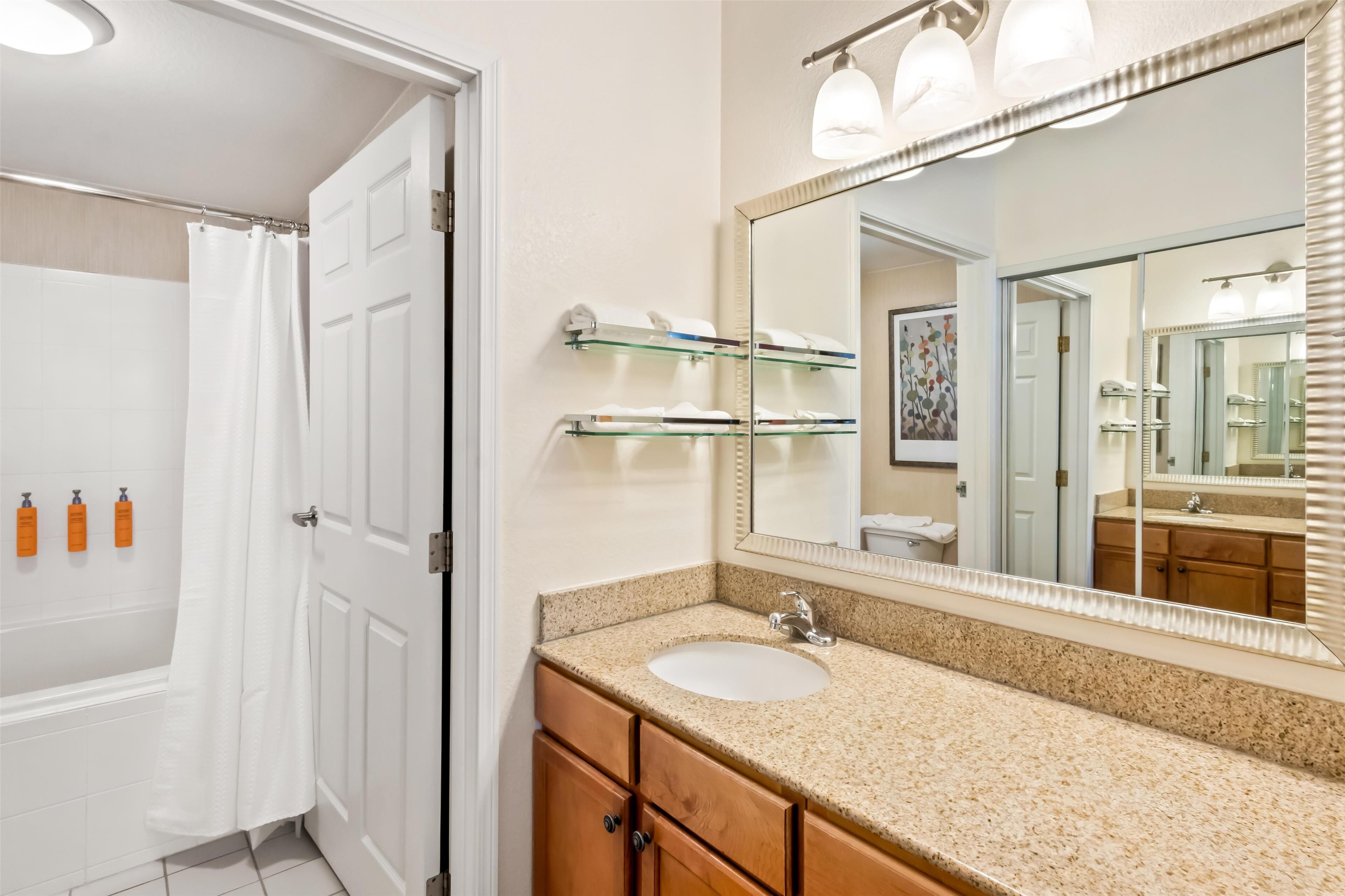 suite, multiple beds | bathroom | combined shower/bathtub, free toiletries, hair dryer, towels