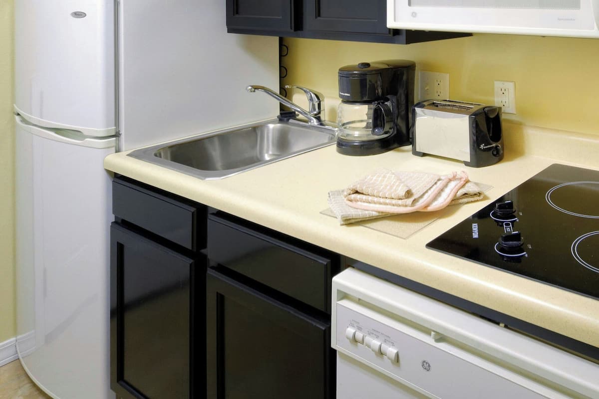 full-sized fridge, microwave, stovetop, dishwasher