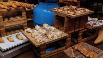 A bakery display with various baked goods.