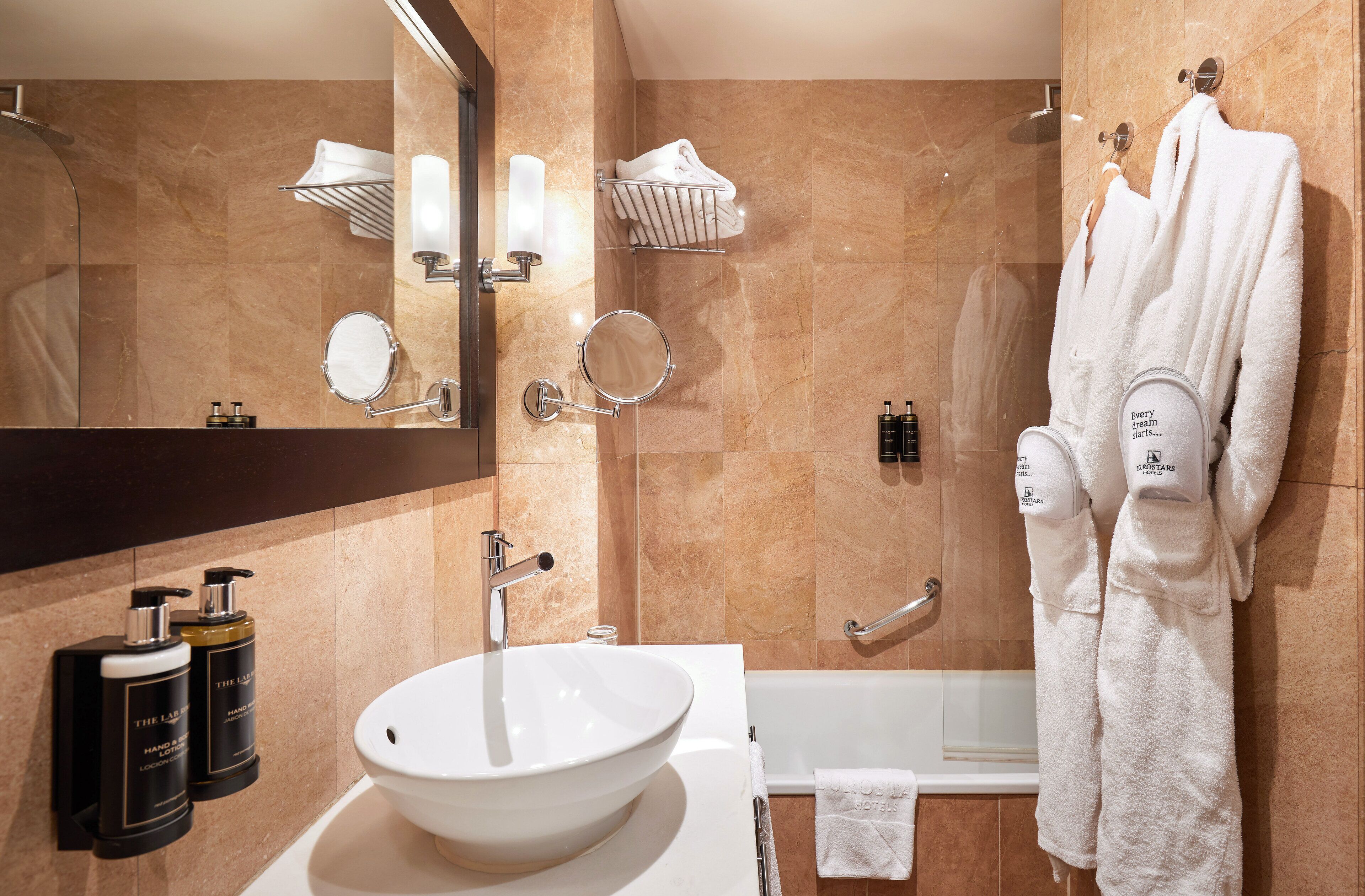 deep-soaking bathtub, rainfall showerhead, eco-friendly toiletries