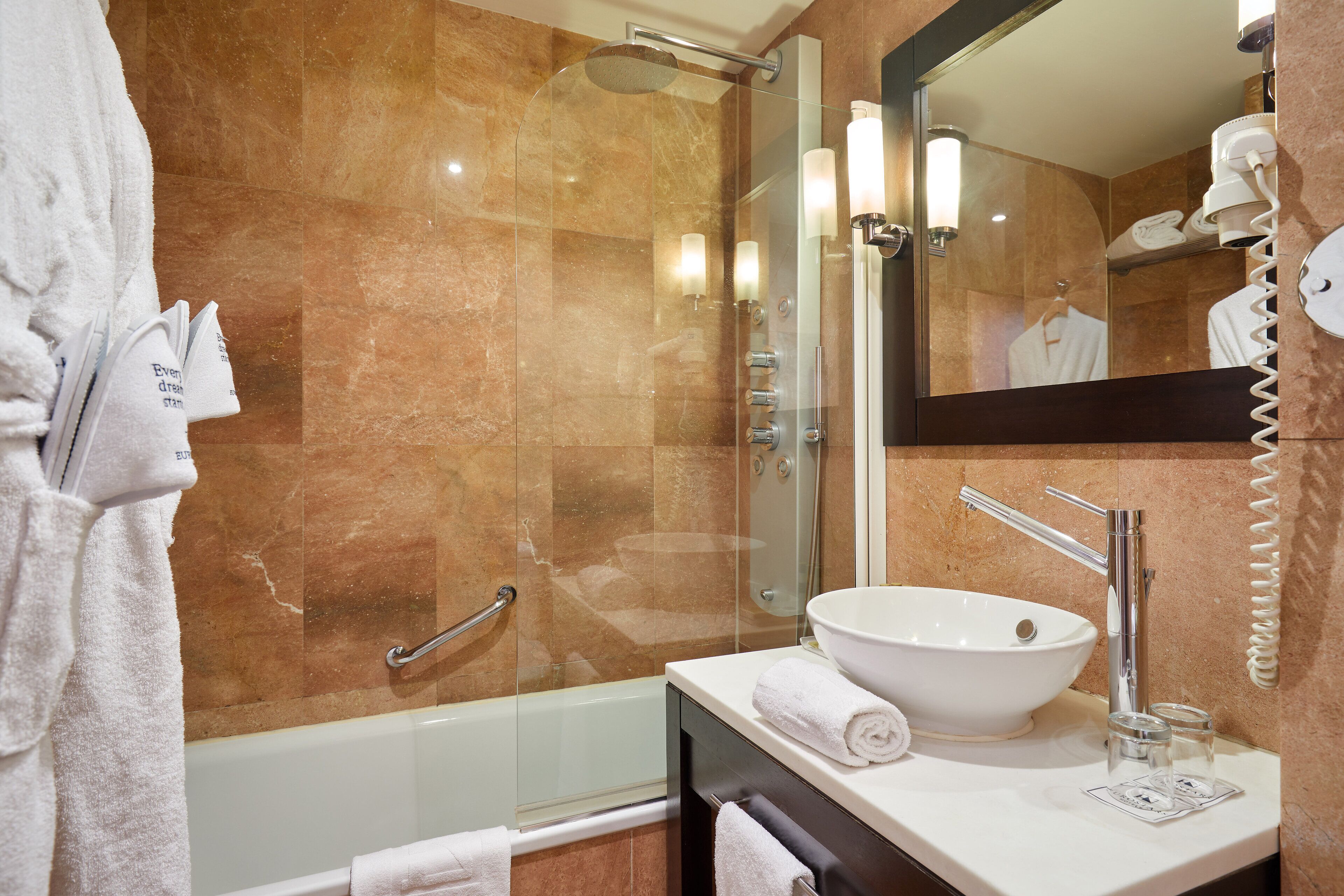 deep-soaking bathtub, rainfall showerhead, eco-friendly toiletries