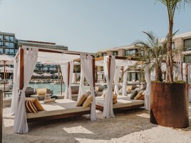 3 outdoor pools, open 10:00 AM to 7:00 PM, free cabanas, pool umbrellas