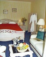 Suíte Deluxe | Frigobar, cofres nos quartos, ferros/tábuas de passar roupa