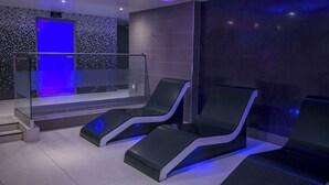 A modern spa room with two reclining chairs, a glass railing, and a sign indicating an ice room. - Best Western Premier Suites Hotel & Spa Liverpool-Knowsley (Liverpool)