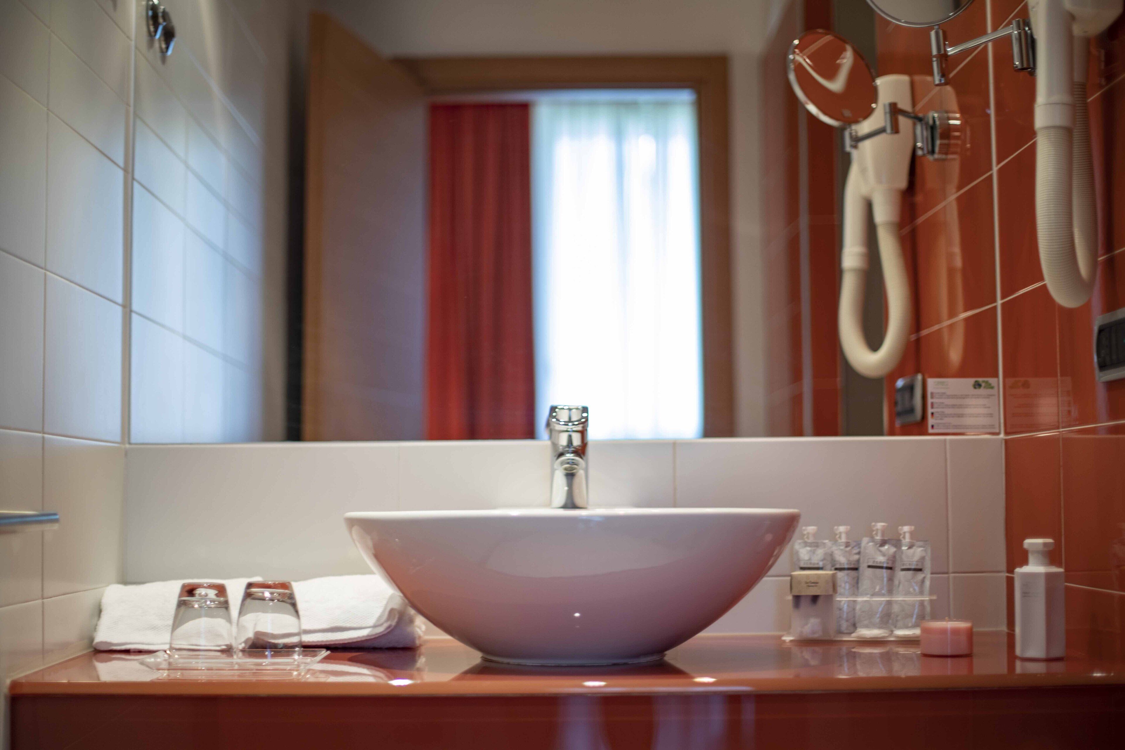 deep-soaking bathtub, rainfall showerhead, free toiletries, hair dryer