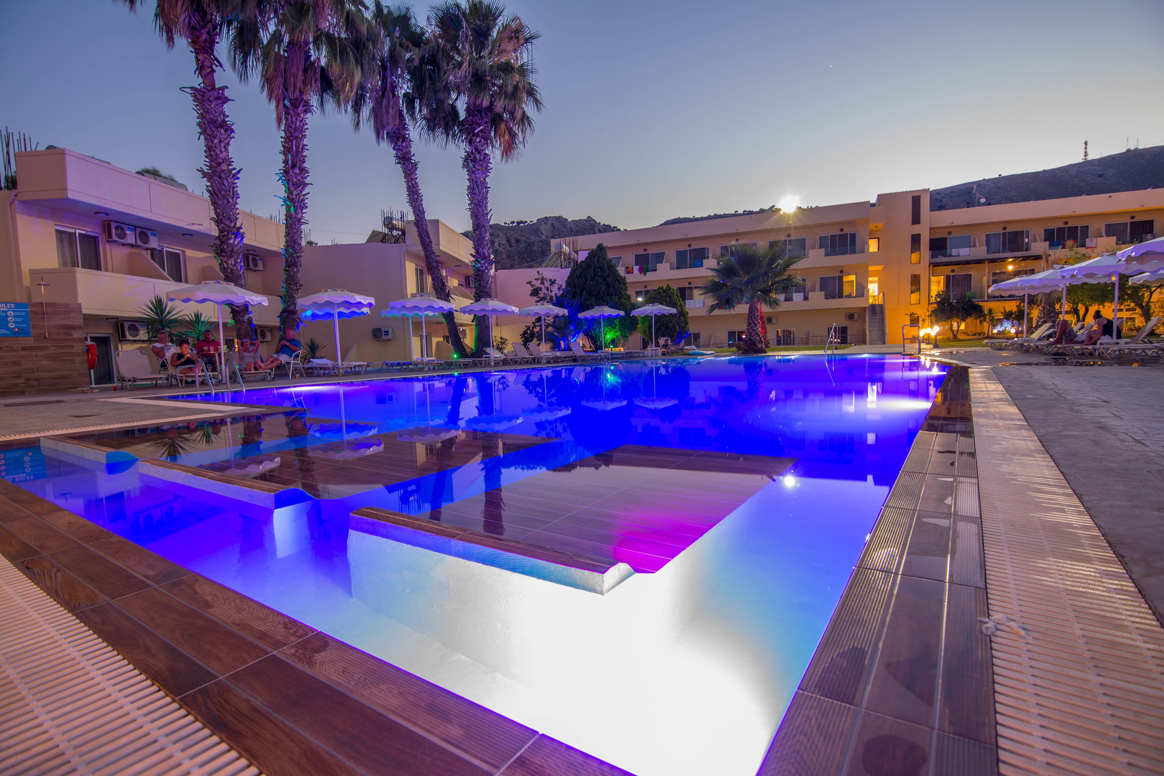 Seasonal outdoor pool, open 10:00 AM to 7:00 PM, pool umbrellas