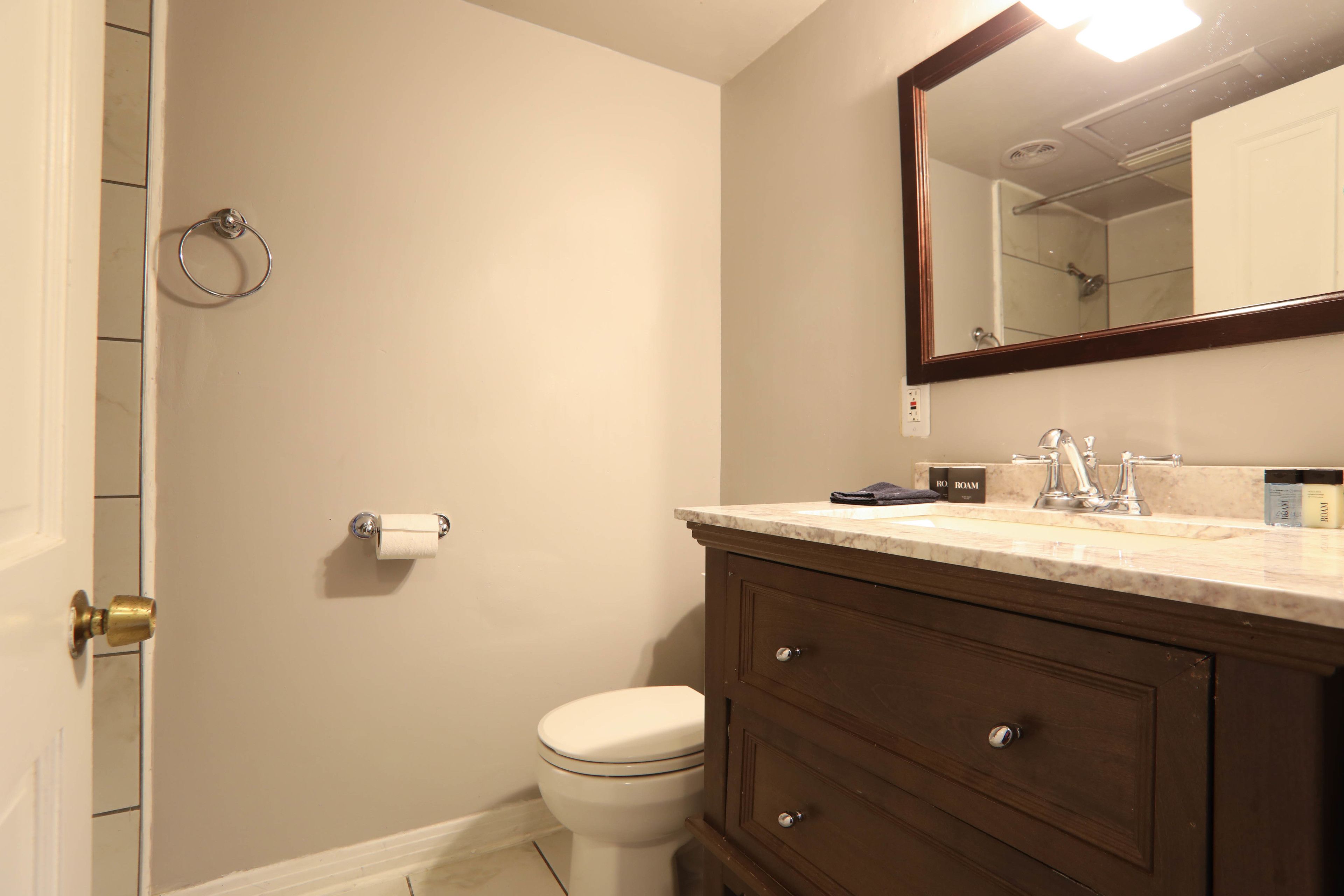 1 queen bed, courtyard w/ balcony | bathroom | free toiletries, hair dryer, towels