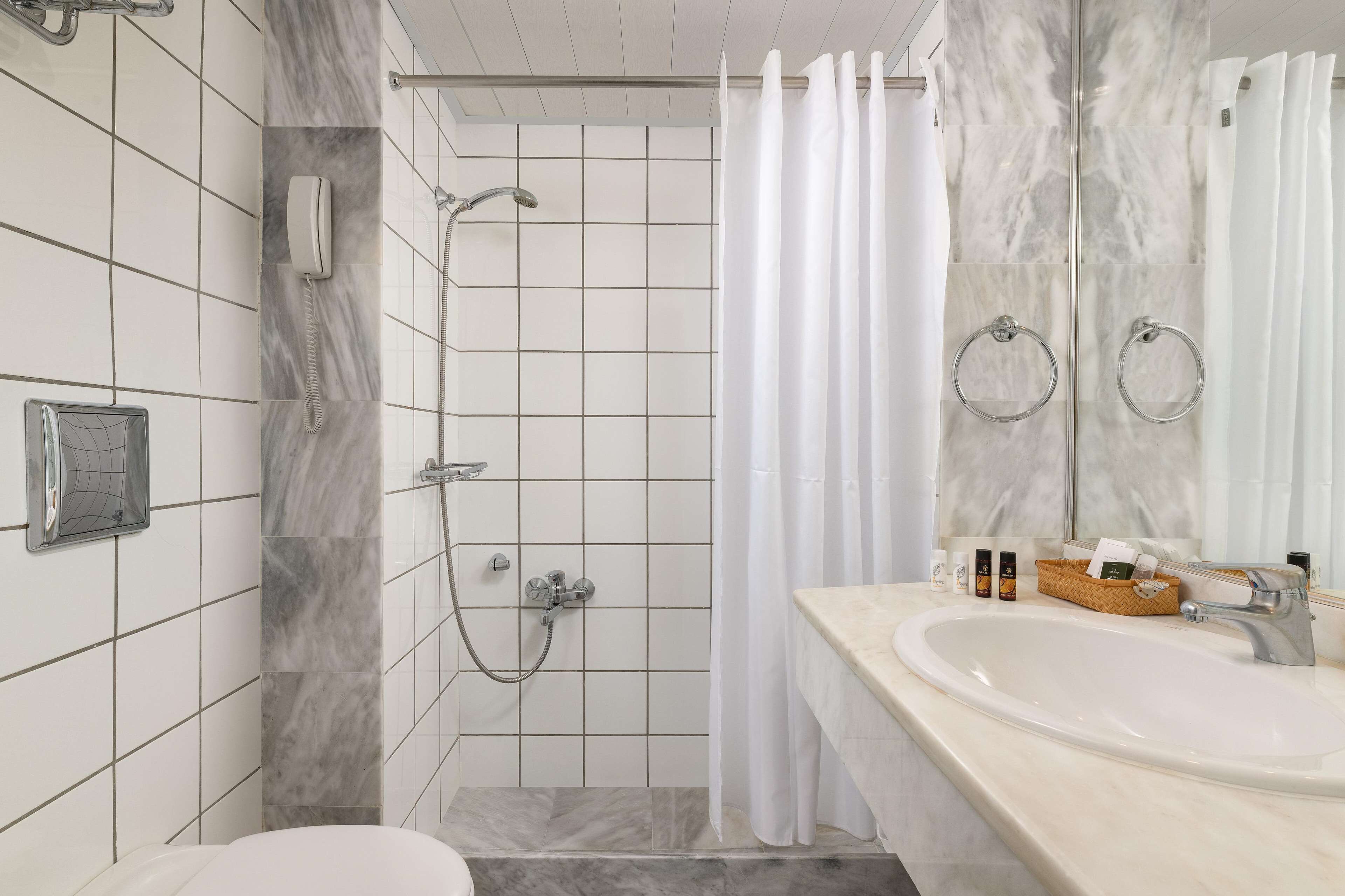 designer toiletries, hair dryer, towels, soap