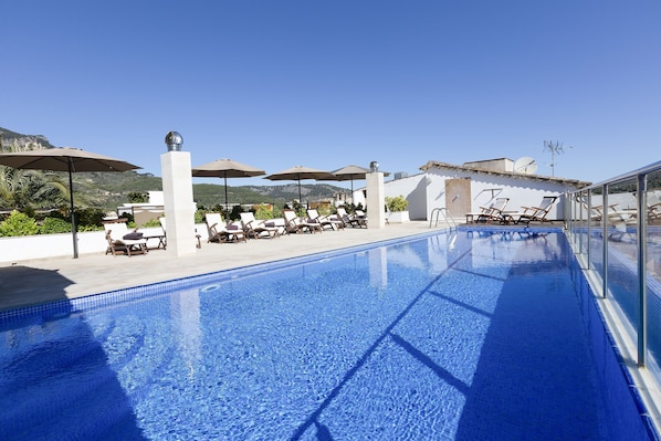 Indoor pool, seasonal outdoor pool, pool umbrellas, pool loungers