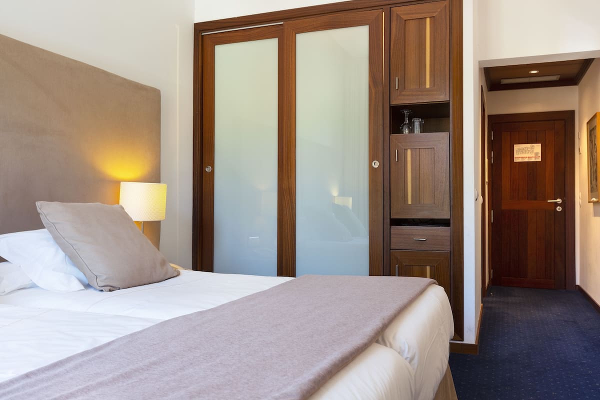 Premium bedding, down comforters, memory foam beds, minibar