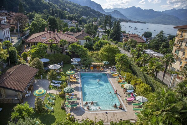 Seasonal outdoor pool, pool umbrellas, pool loungers