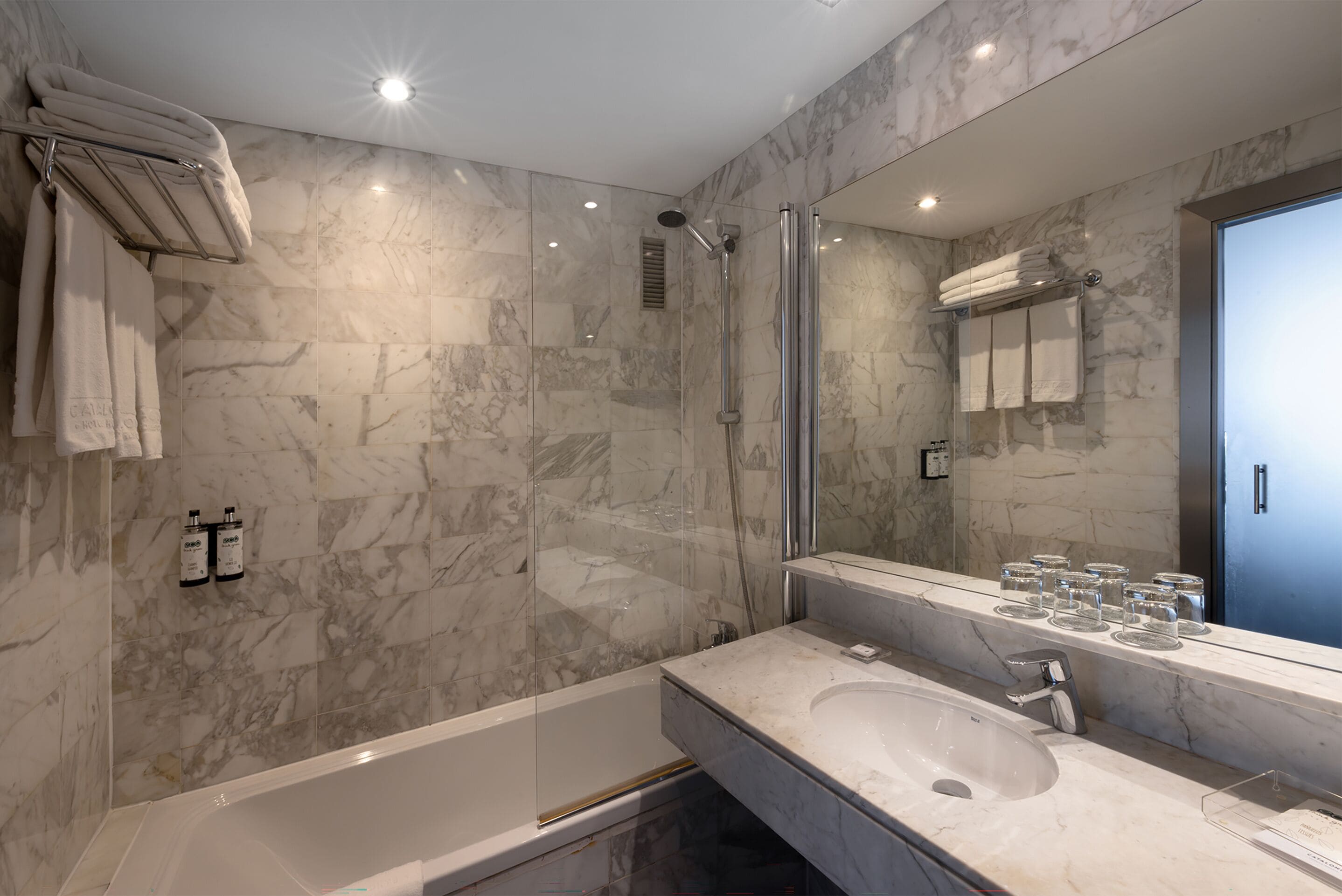 eco-friendly toiletries, hair dryer, towels