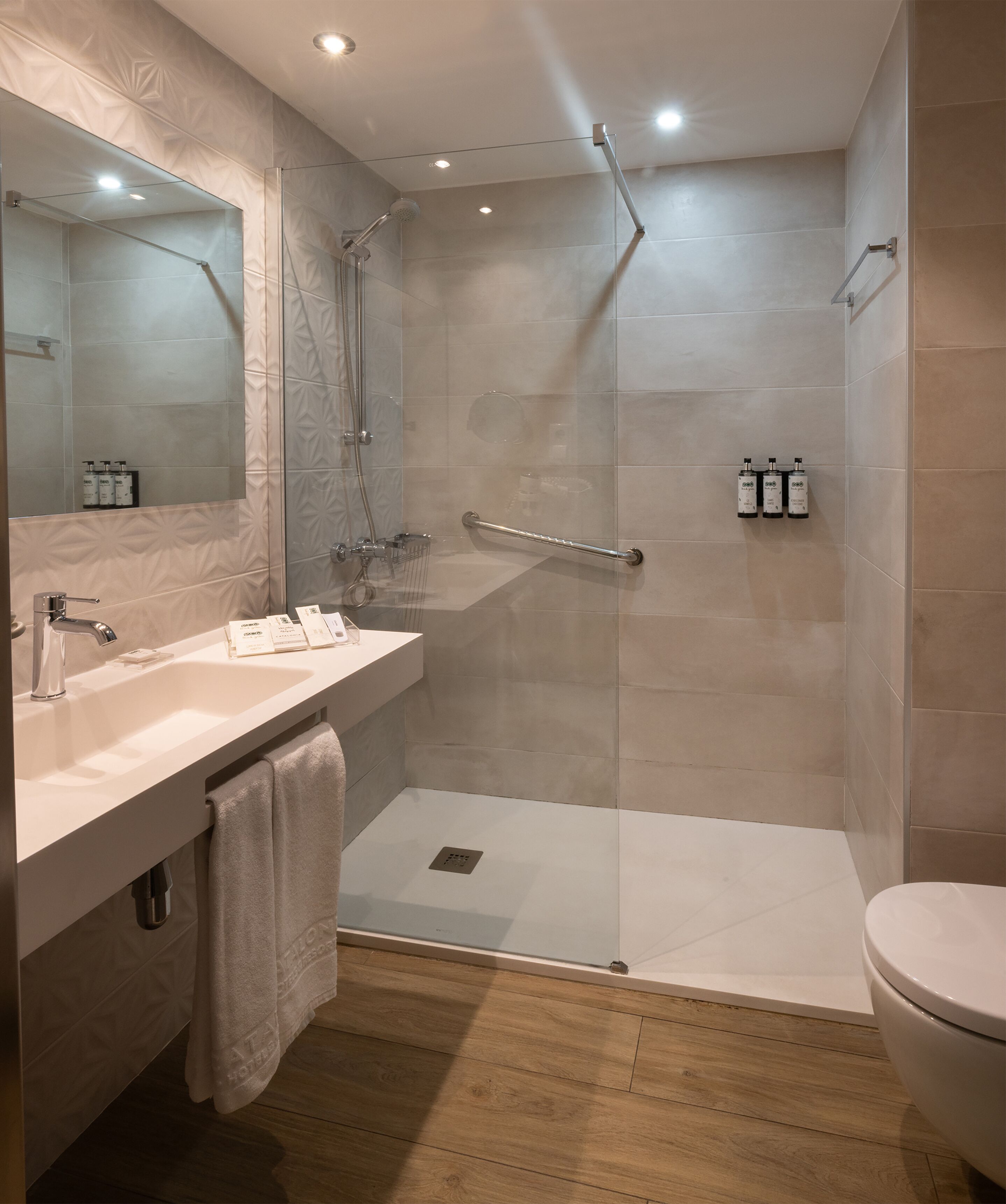 eco-friendly toiletries, hair dryer, towels