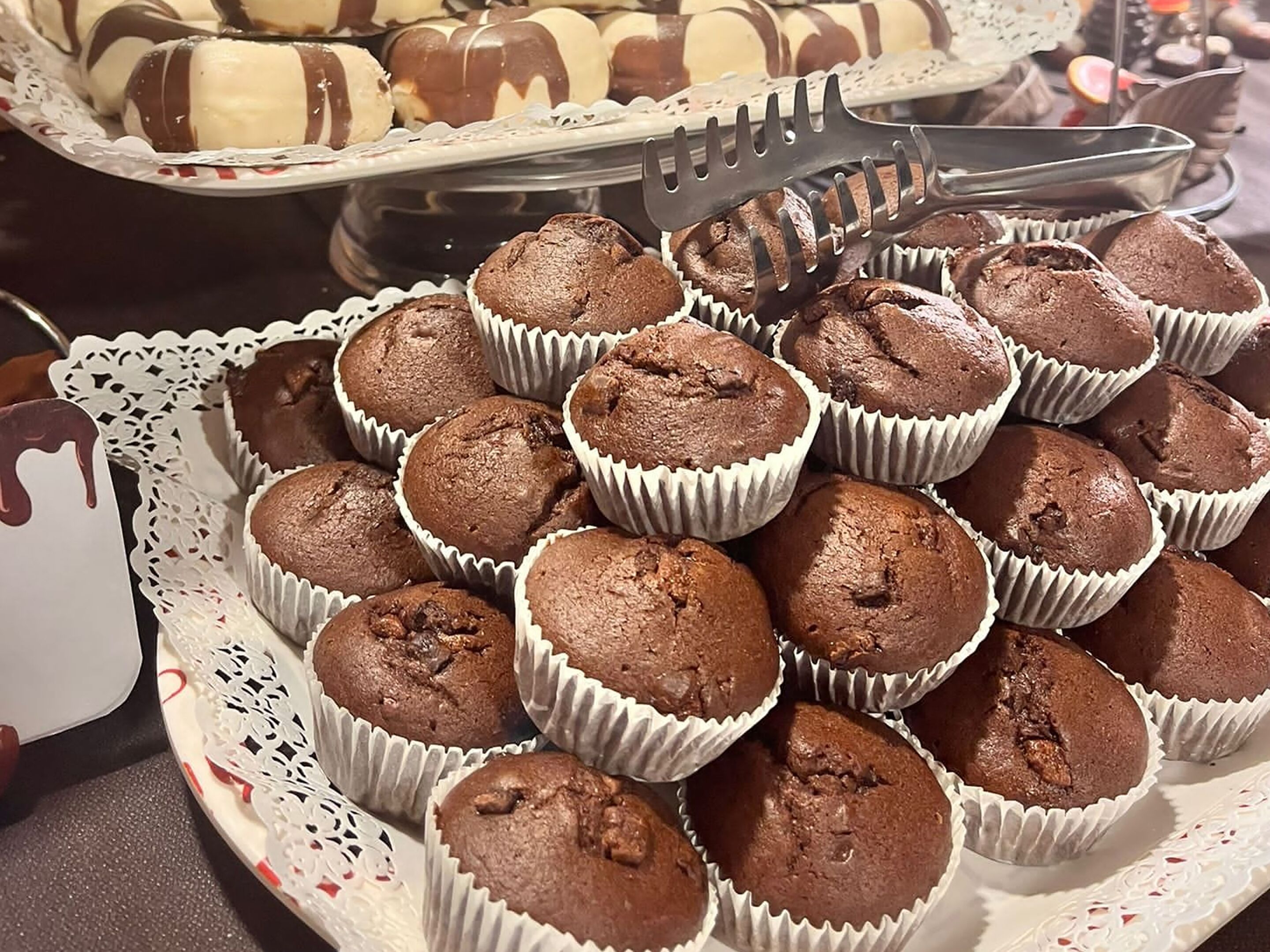 A tray of chocolate muffins in paper cups.