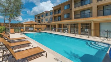 Outdoor pool, open 7:00 AM to 11:00 PM, pool loungers