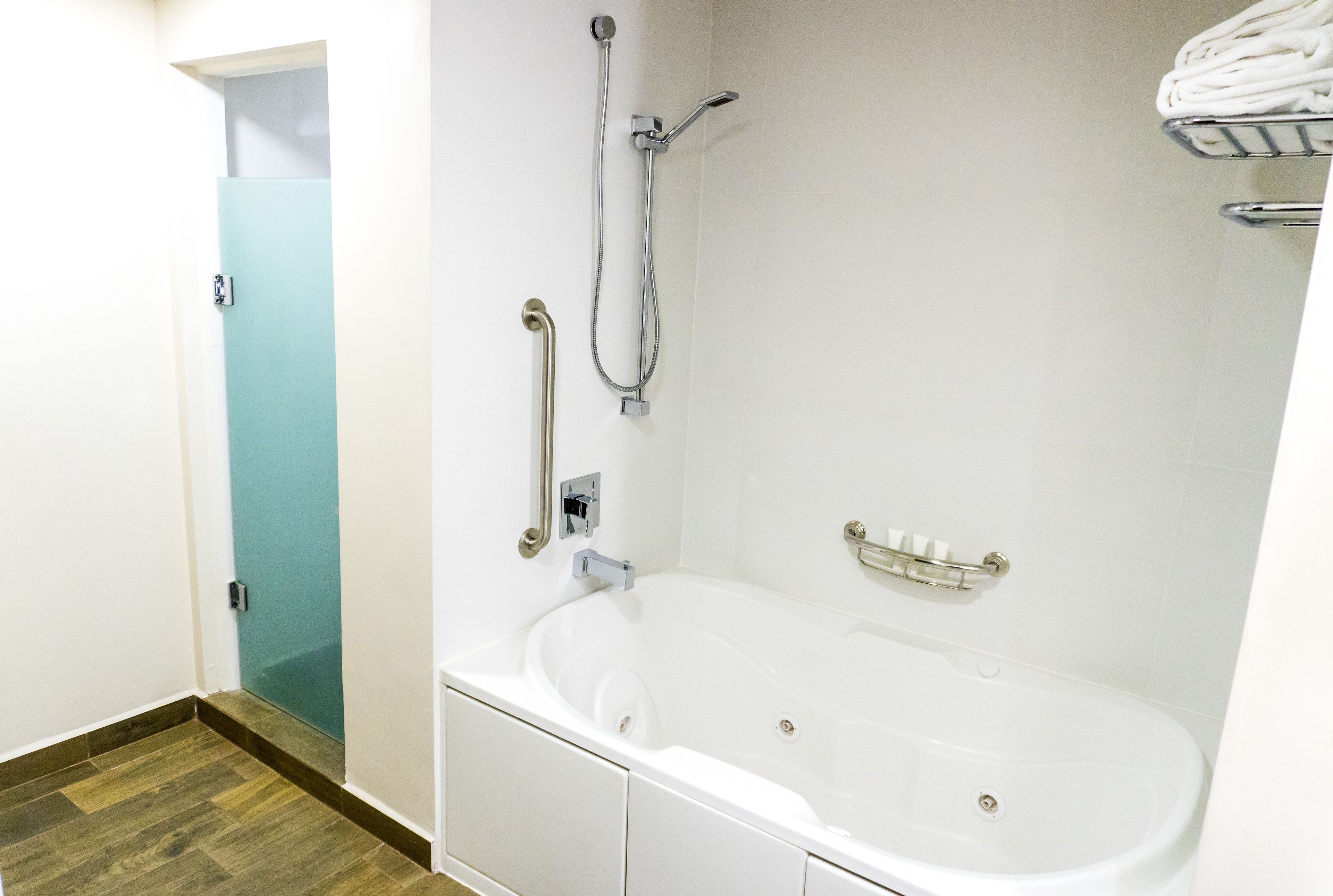 rainfall showerhead, designer toiletries, hair dryer, towels