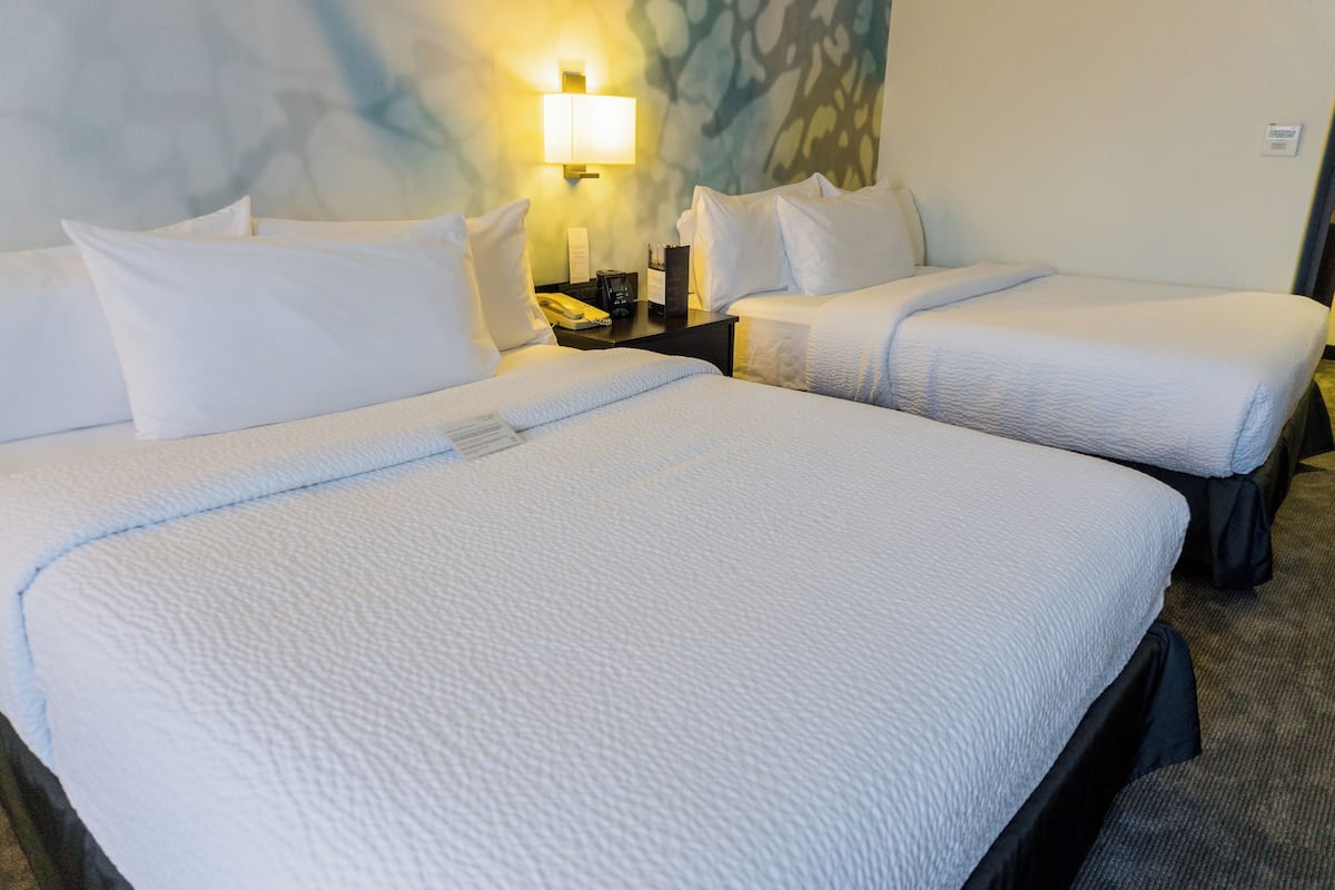 deluxe room, 2 queen beds, non smoking | 1 bedroom, down duvets, pillow-top beds, in-room safe