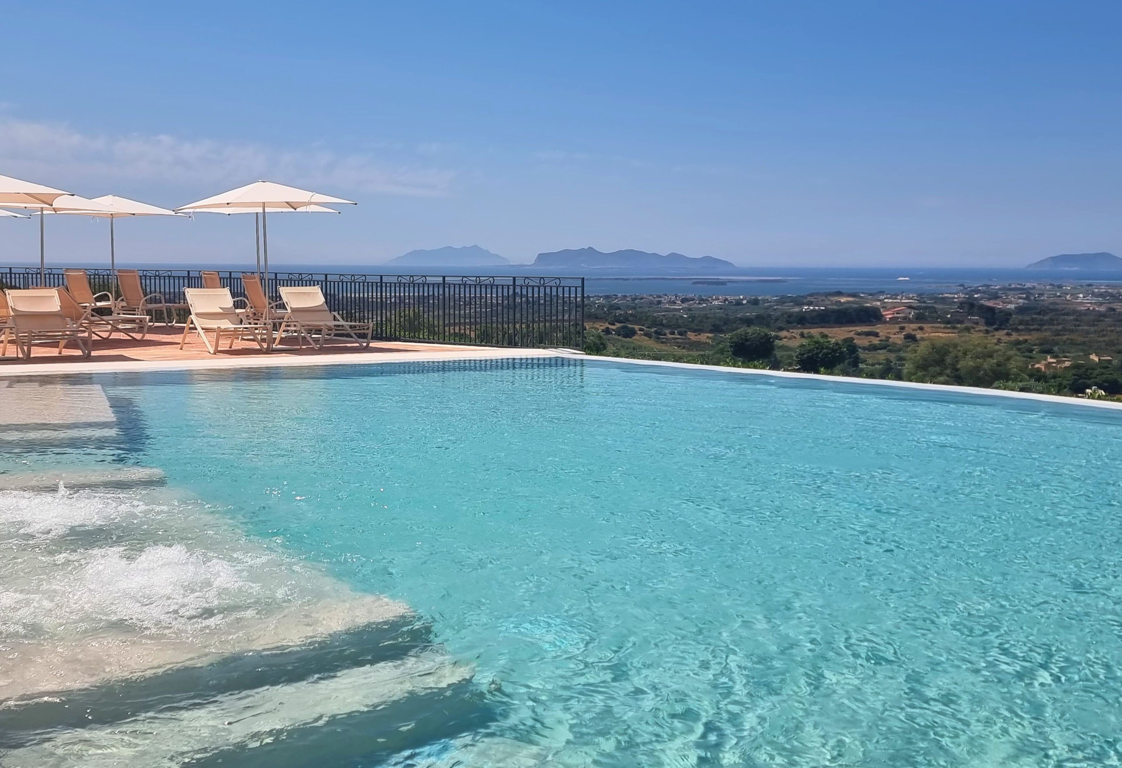 seasonal outdoor pool, pool umbrellas, pool loungers