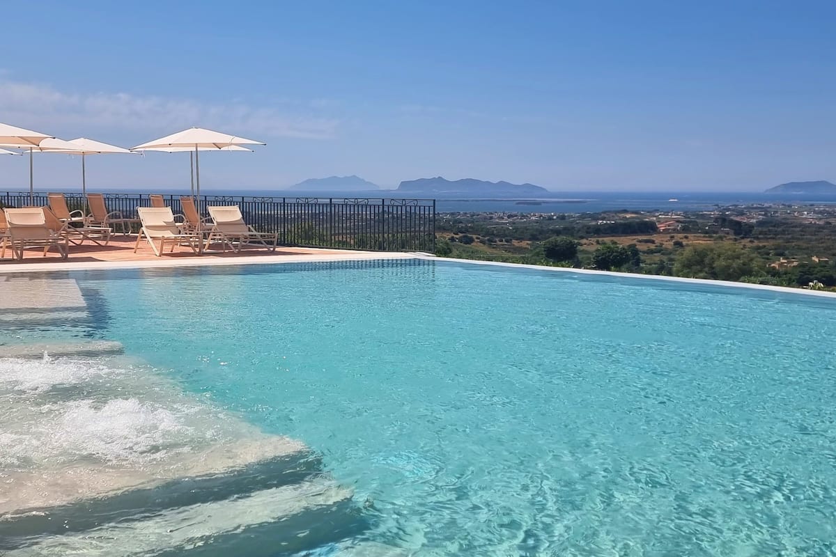 seasonal outdoor pool, pool umbrellas, pool loungers