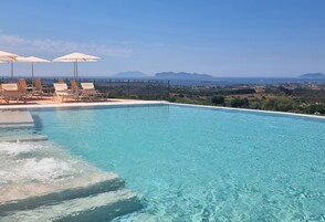 Seasonal outdoor pool, pool umbrellas, sun loungers