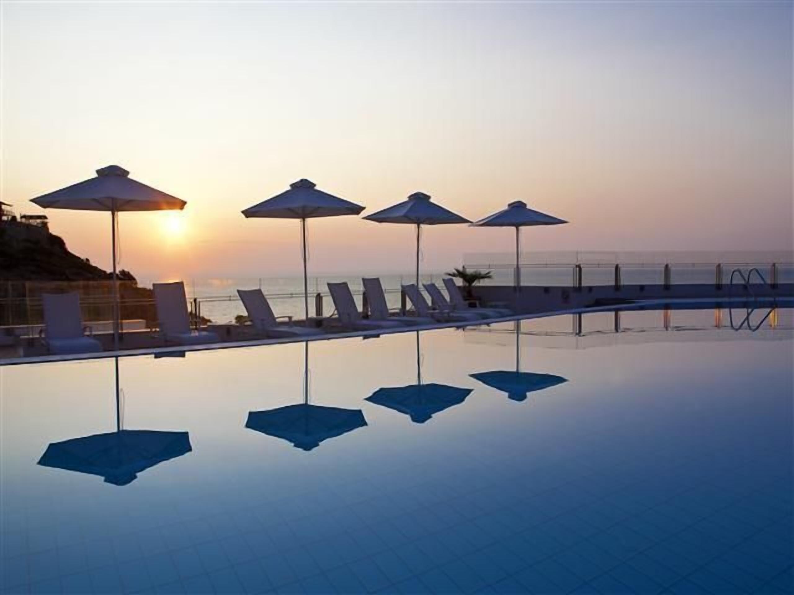 seasonal outdoor pool, pool umbrellas, pool loungers